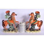 A PAIR OF 19TH CENTURY STAFFORDSHIRE FIGURES OF HORSES modelled roaming. 25 cm x 15 cm.