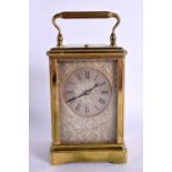 A GOOD 19TH CENTURY FRENCH REPEATING BRASS CARRIAGE CLOCK with silvered face plate, in the manner of