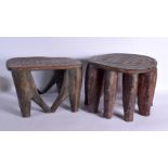 A LARGE NEAR PAIR OF EARLY 20TH CENTURY AFRICAN TRIBAL WOOD STOOLS with chip carved decoration. Larg