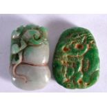 TWO CARVED JADE PENDANTS. Largest 5.3cm x 3.4cm, weight 99g total (2)