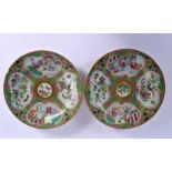 A PAIR OF 19TH CENTURY CHINESE CANTON FAMILLE ROSE PLATES Qing, painted with figures in landscapes.