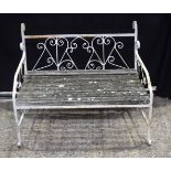 An antique cast iron and wooden slated bench 75 x 91 x 6€ cm.