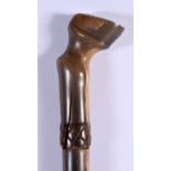 A 19TH CENTURY MIDDLE EASTERN CARVED RHINOCEROS HORN SHOE HORN SWAGGER STICK with hoof terminal. 60