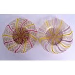 AN UNUSUAL PAIR OF EARLY 20TH CENTURY GLASS TWIST PLATES with pink swirling decoration. 19 cm wide.