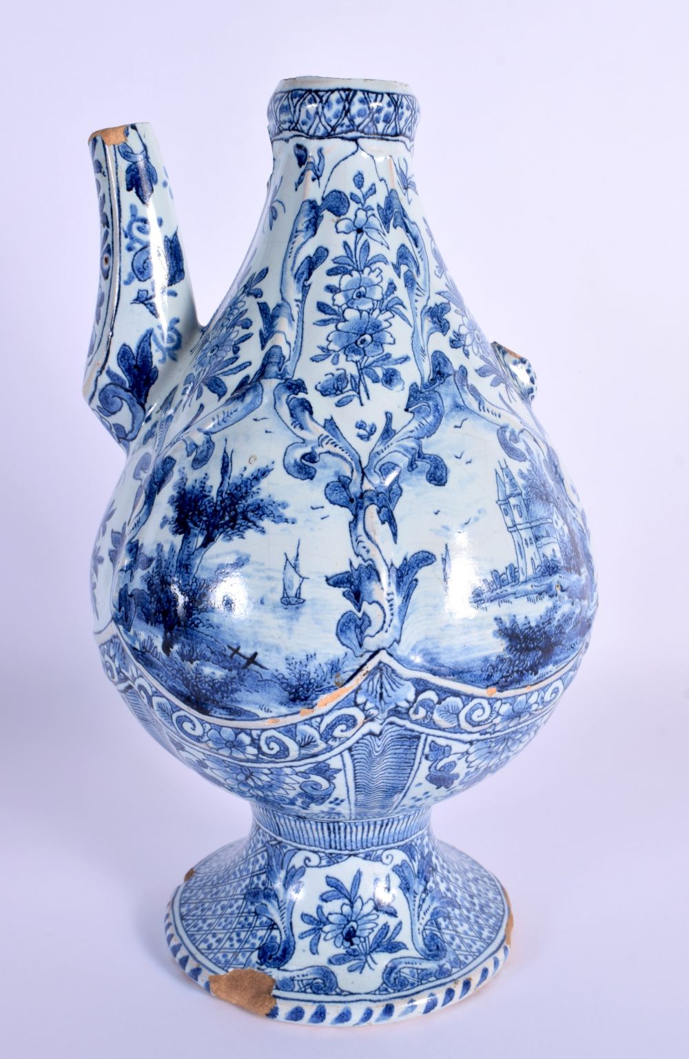 A 19TH CENTURY DELFT BLUE AND WHITE TIN GLAZED EWER painted with boats and landscapes. 26 cm x 12 cm