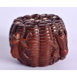 A JAPANESE NETSUKE CARVED AS FLIES ON A BASKET. 3.4cm x 5.4cm, weight 44.6g