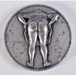 A RARE 1950S EROTIC BUM BEARING GLORIA MEDALLION. 5 cm diameter.