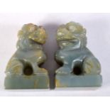 A PAIR OF CARVED JADE TEMPLE DOGS. 4.1cm x 2.7cm x 1.9cm (2)