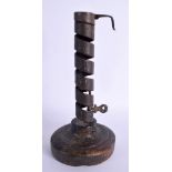 AN 18TH CENTURY IRON PIG TAIL CURLY CANDLESTICK. 20 cm high.