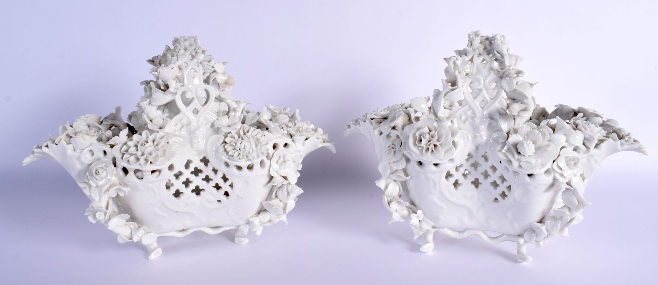 A PAIR OF 19TH CENTURY GERMAN BLANC DE CHINE PORCELAIN BASKETS Meissen style, encrusted all over wit