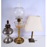 An brass oil lamp together with a brass column lampstand and another oil lamp base.