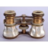 A PAIR OF ANTIQUE MAPPIN & WEBB OPERA GLASSES with extending handle. 24 cm wide with handle extended