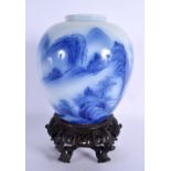 AN EARLY 20TH CENTURY JAPANESE MEIJI PERIOD BLUE AND WHITE VASE upon a hardwood stand. 26 cm x 12 cm