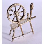 A SILVER MODEL OF A SPINNING WHEEL. Hallmarked London 1982, 6.8cm x 5.7cm, weight 43g