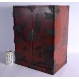 A LARGE EARLY 20TH CENTURY CHINESE RED LACQUERED TABLE CABINET the doors decorated with boats and la