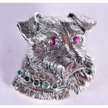 A STERLING SILVER DOG BROOCH WITH GEM SET EYES. Stamped Sterling, 2.9cm x 2.8cm, weight 11.6g