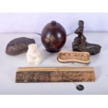 A miscellaneous collection including a small bronze figure, tortoise shell, carved stone bear, Islam