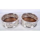 A PAIR OF 1970S SILVER BOTTLE COASTERS. London 1975. 662 grams. 15 cm x 6 cm.