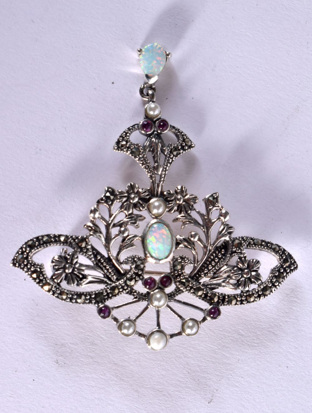 A SILVER BUTTERFLY BROOCH INSET WITH OPALS AND MARCASITE. 5.8cm x 5.5cm, weight 10.4g