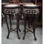 A PAIR OF 19TH CENTURY CHINESE CARVED HARDWOOD MARBLE INSET STANDS. 78 cm x 34 cm.