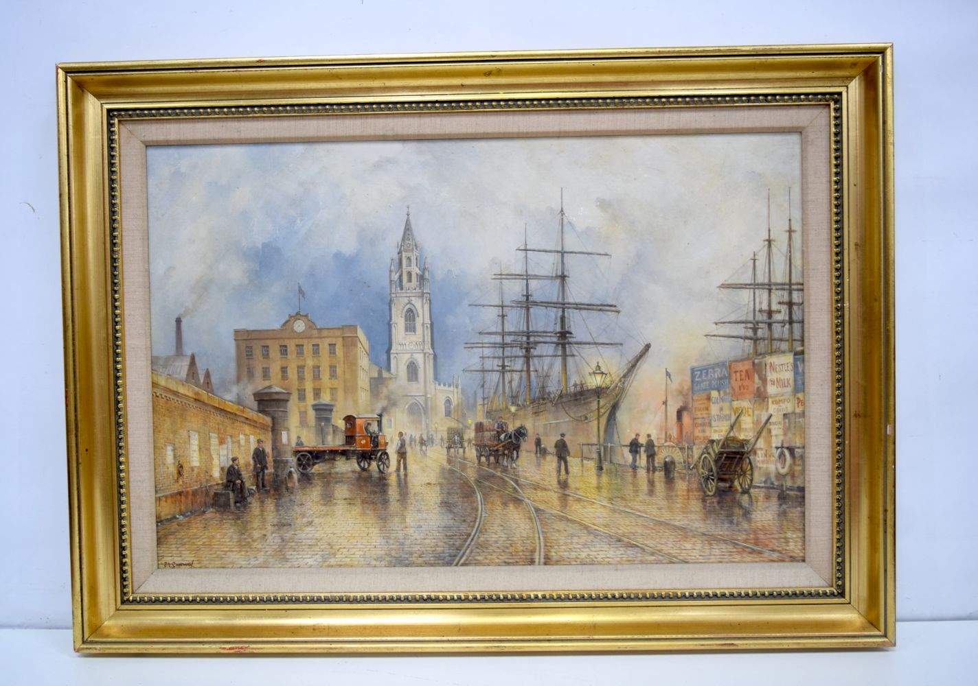 A large framed oil on board by J L Chapman of a harbour scene. 49 x 74cm.