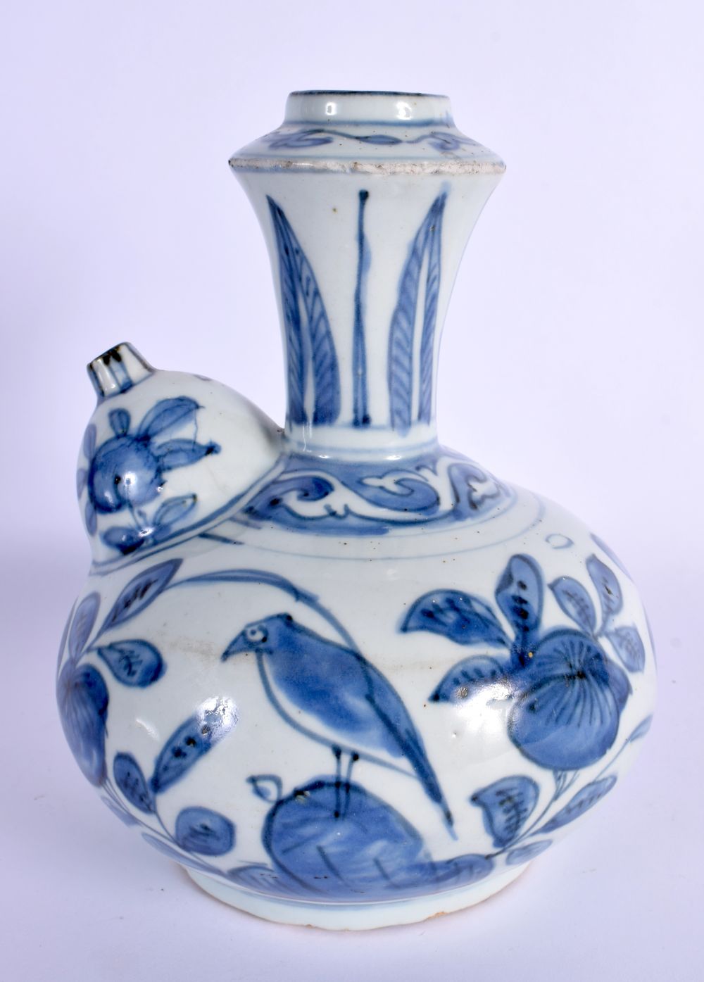 A 17TH CENTURY CHINESE BLUE AND WHITE PORCELAIN KENDI Ming, painted with birds amongst foliage and v