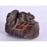 A JAPANESE NETSUKE CARVED AS RATS ON A BASKET. 3.3cm x 3.8cm x 3cm, weight 16g