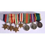 A MOUNTED SET OF MINIATURE MEDALS