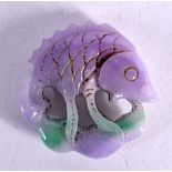 A LILAC JADE FISH. 5.4cm diameter, weight 50g