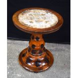 A wooden veneered pedestal occasional table with a butterfly wing glazed top 61 x 53 cm.