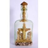 A RARE EARLY 20TH CENTURY CONTINENTAL FOLK ART CRUCIFIX BOTTLE AND STOPPER formed with Christ above