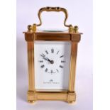 A CASED CARRIAGE CLOCK BY MATTHEW NORMAN. Hight 15.5cm (handle extended), width 8.3cm, with key