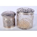 A VICTORIAN SILVER TOPPED GLASS JAR and an Indian white metal jar. Silver 110 grams. Birmingham 1896