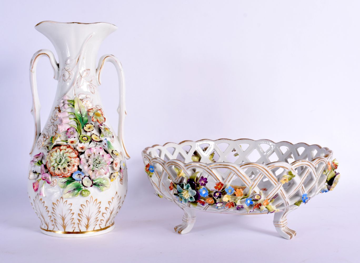 A CONTINENTAL RETICULATED PORCELAIN BASKET together with a twin handled encrusted porcelain vase. La
