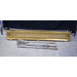 An antique brass fender together with fireside tools 21 x 137 x 30 cm (4)