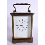 A CARRIAGE CLOCK BY MATTHEW NORMAN. Hight 17.2cm (handle extended), width 9.5cm, with key