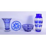 FOUR BOHEMIAN BLUE FLASH GLASS ITEMS including a thistle cut bowl. Largest 30 cm high. (4)
