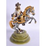 A 1940S GILT AND SILVERED BRONZE FIGURE OF A CAVALIER modelled upon a rearing horse. 22 cm x 14 cm.