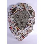 AN UNUSUAL CONTEMPORARY ROLLED PAPER PLAQUE OF A LION. 57 cm x 40 cm.