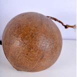 AN UNUSUAL POLYNESIAN CARVED COCONUT possibly a fishing float. 21 cm wide.