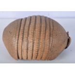 An armadillo basket 23 x 10 cm.