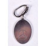 A SILVER MERCEDES TAG. 28 grams. 12 cm x 3.75 cm,