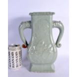 A VERY RARE EARLY CHINESE TWIN HANDLED LONGQUAN CELADON VASE Yuan/Ming, decorated in relief with fis