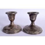 A PAIR OF STERLING SILVER CANDLESTICKS, Stamped Sterling 875, 8.7cm x 9.5cm, weighted bottoms (2)