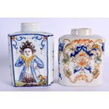 A PAIR OF 19TH CENTURY FRENCH FAIENCE GLAZED TIN GLAZED CANISTERS one decorated with a well known re