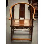 AN EARLY 20TH CENTURY CHINESE CARVED HARDWOOD HORSE SHOE BACK ARM CHAIR. 97 cm x 54 cm.