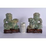 A LARGE PAIR OF 19TH CENTURY CHINESE GREEN QUARTZ STONE FIGURES modelled as Buddhistic lions. 24 cm