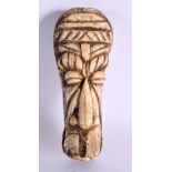 A RARE 19TH CENTURY AFRICAN CARVED BONE TRIBAL MASK HEAD formed as a male. 15 cm x 6 cm.