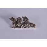 A STERLING SILVER DOG BROOCH WITH GEM SET EYES. Stamped Sterling, 2cm x 4.6cm, weight 9.7g