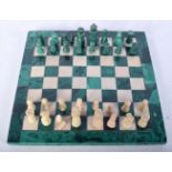 A malachite chess set 23.5 x 23.5 cm.